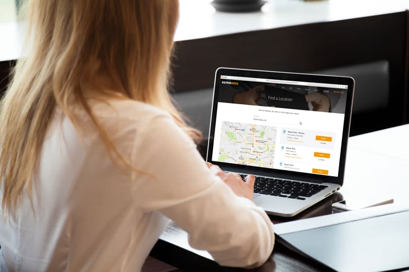 Woman looking for a store nearby on her computer