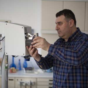 Medical professional repairing a medical instrument