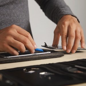 technician repairing a mobile phone
