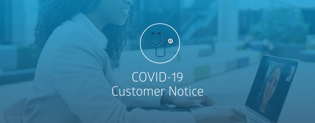 employee working at computer with customer notice