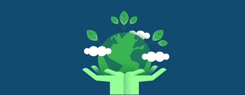 Green Earth held by green hands