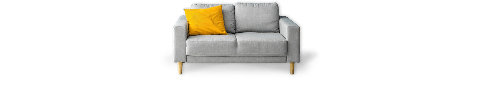 light grey couch with a yellow throw pillow
